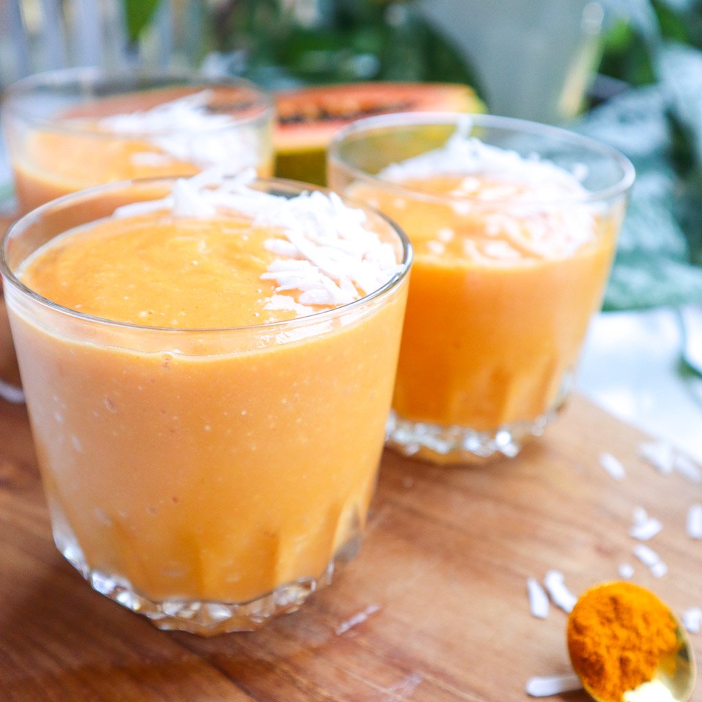three smoothies made with papaya