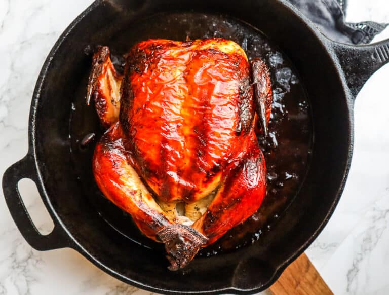 whole roasted chicken in a cast iron