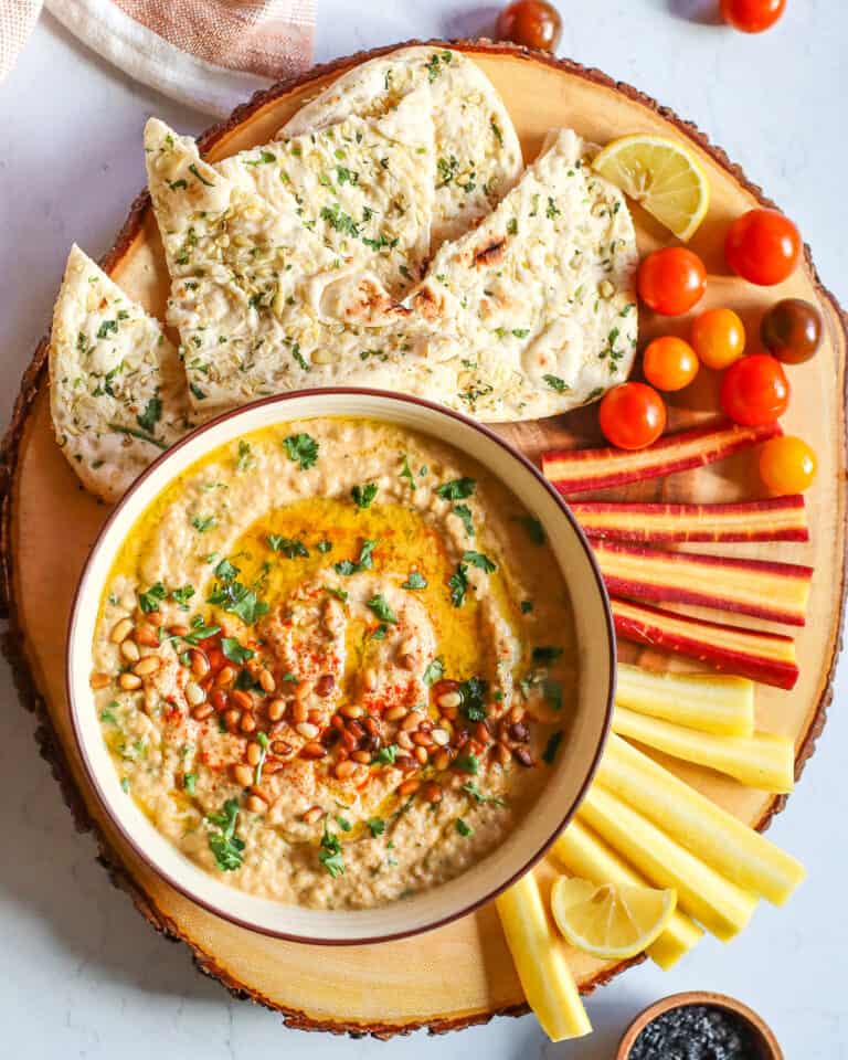 baba ganoush recipe served with pita carrots and tomatoes