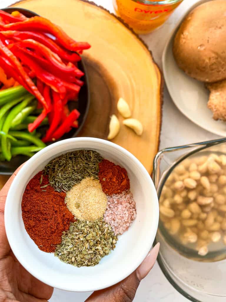 ingredients to make Vegan Creamy Cajun Pasta with peppers and mushrooms and cajun spices