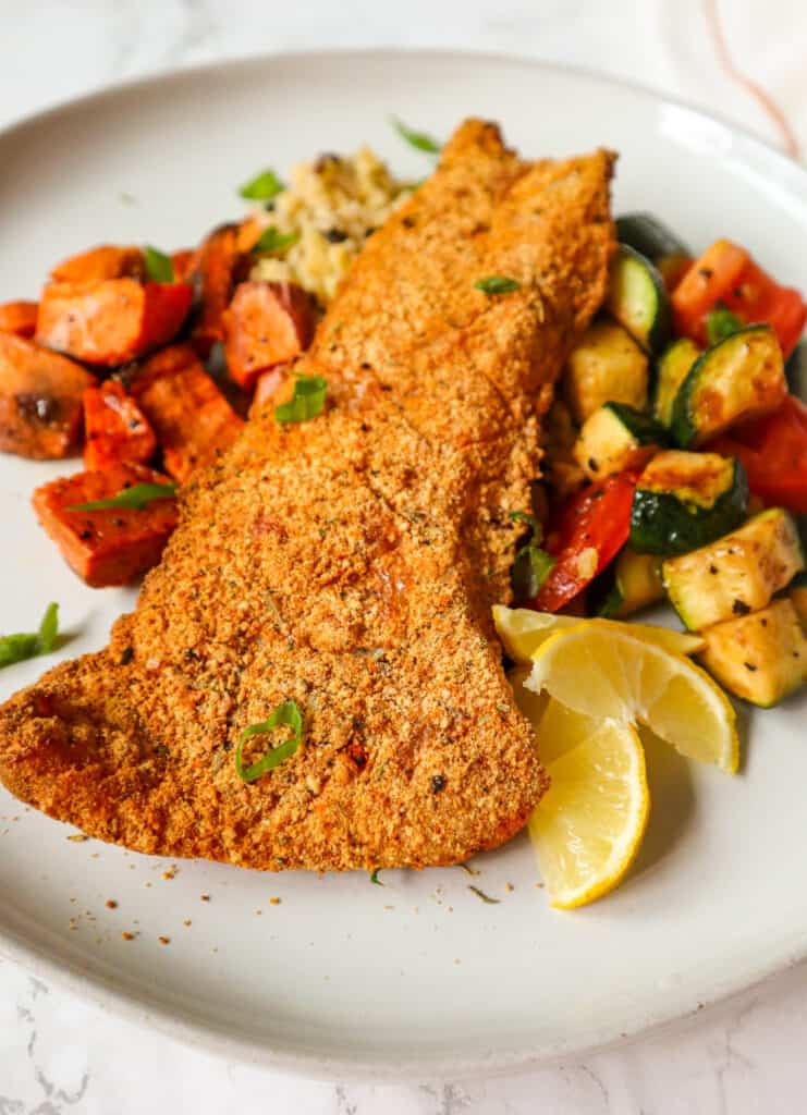 Crispy Gluten-Free Breaded Air Fryer Fish served over rice with potatoes and vegetables