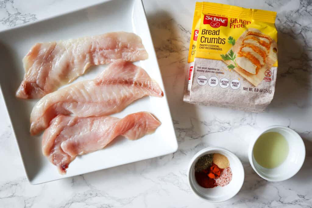 Ingredients needed to make gluten free breaded air fryer fish: fish, cooking oil, seasonings, and gluten free bread crumbs