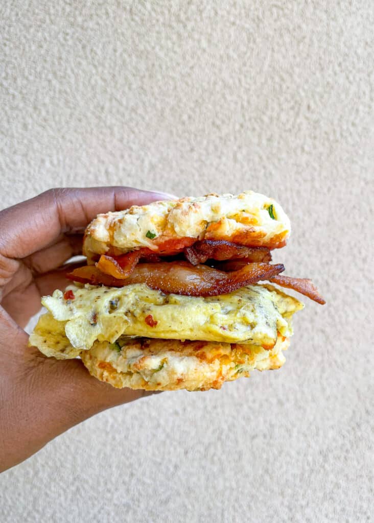 Breakfast sandwich using gluten free biscuits, eggs, and bacon