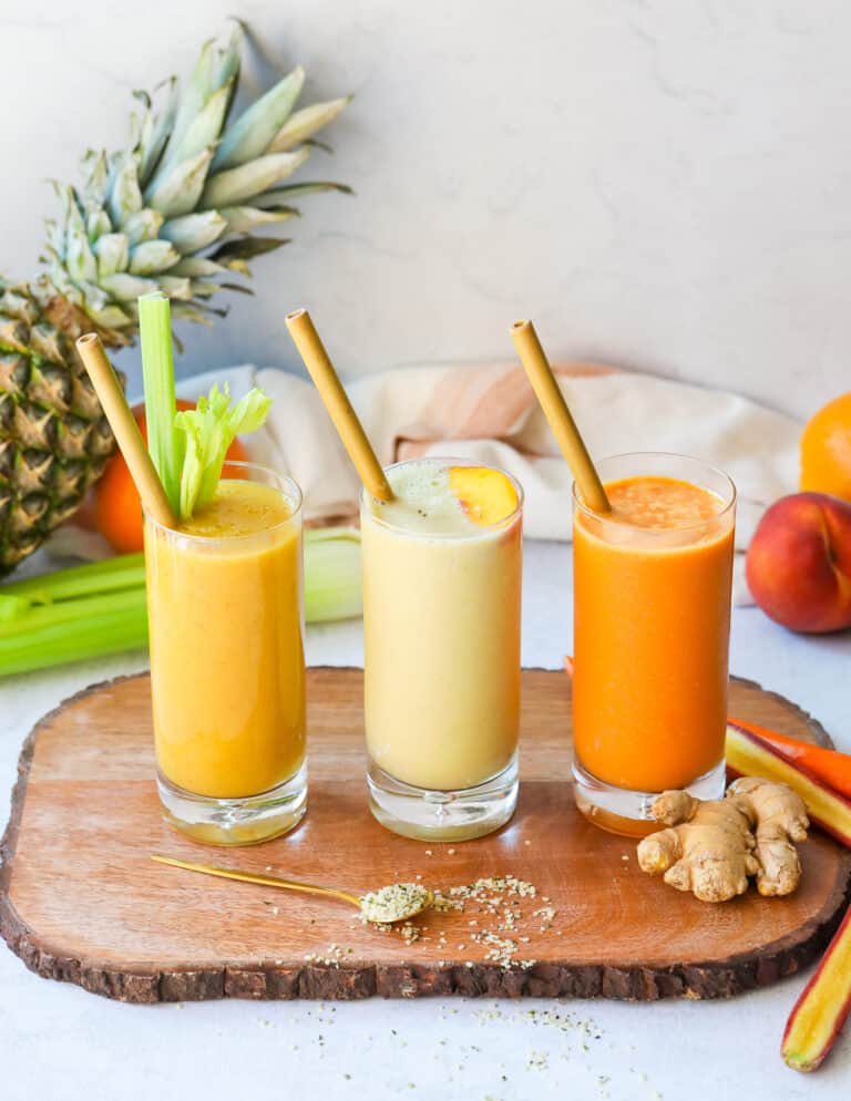 Three Superfood Smoothies that are various shades of orange