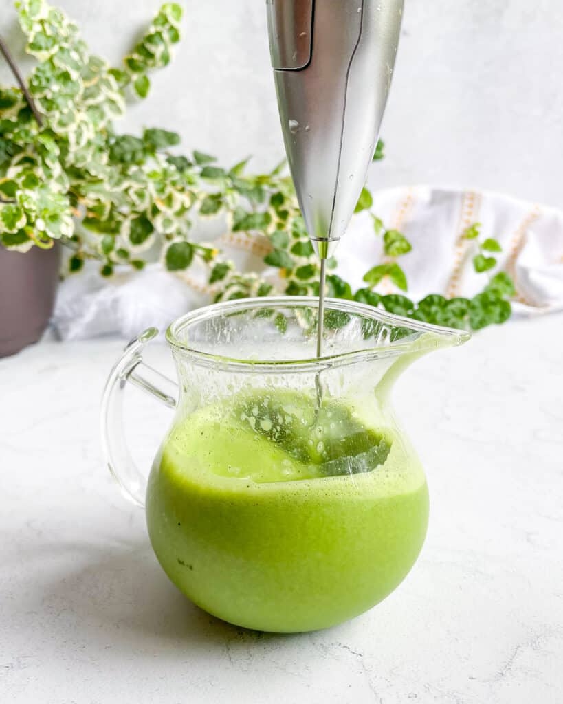 Mixing matcha powder with non-dairy milk or creamer