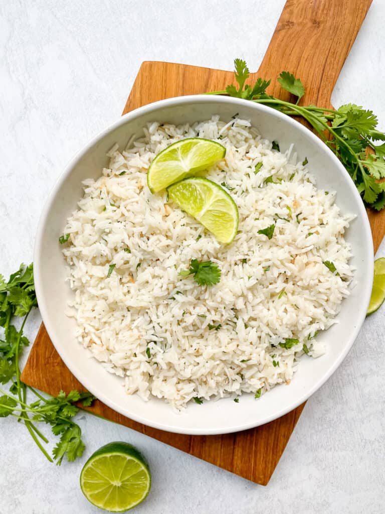 Coconut Cilantro Lime Rice in a large bowl served with lime wedges