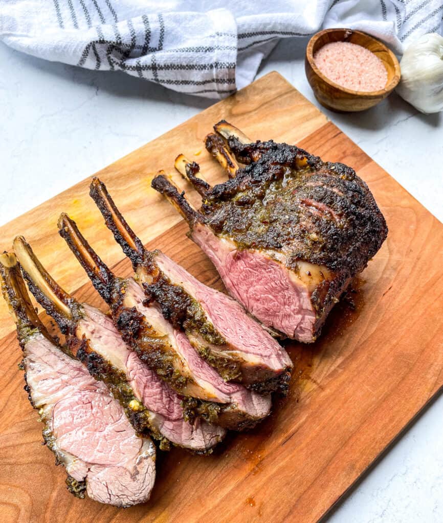 Cooked Jerk Rack of Lamb with few pieces sliced