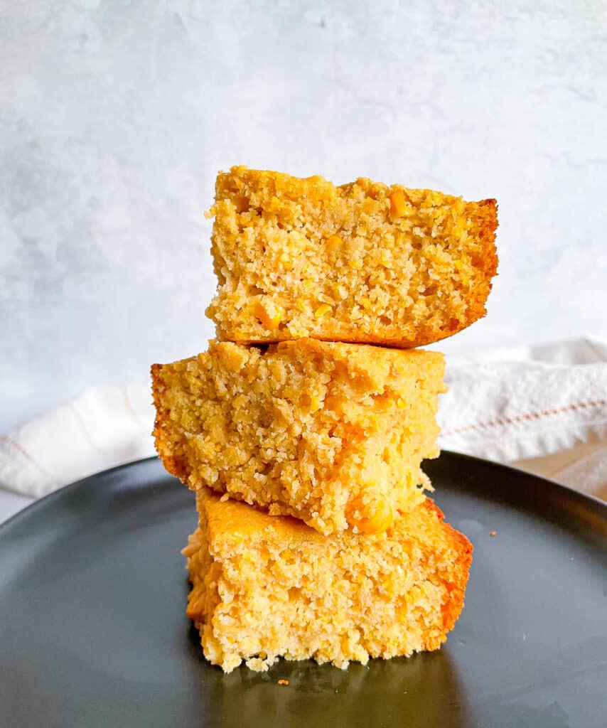 3 pieces of  gluten free cornbread stacked on one another to show texture