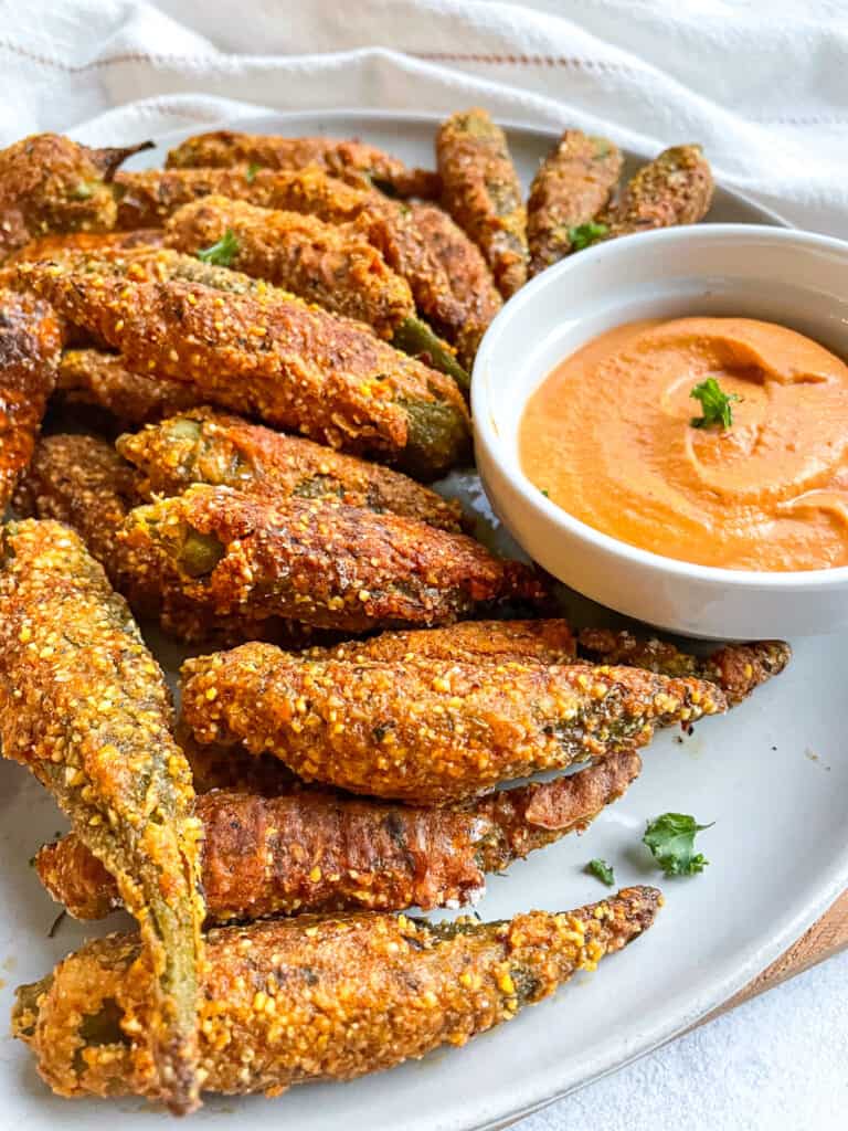 crispy air fryer okra served with creamy chipotle sauce