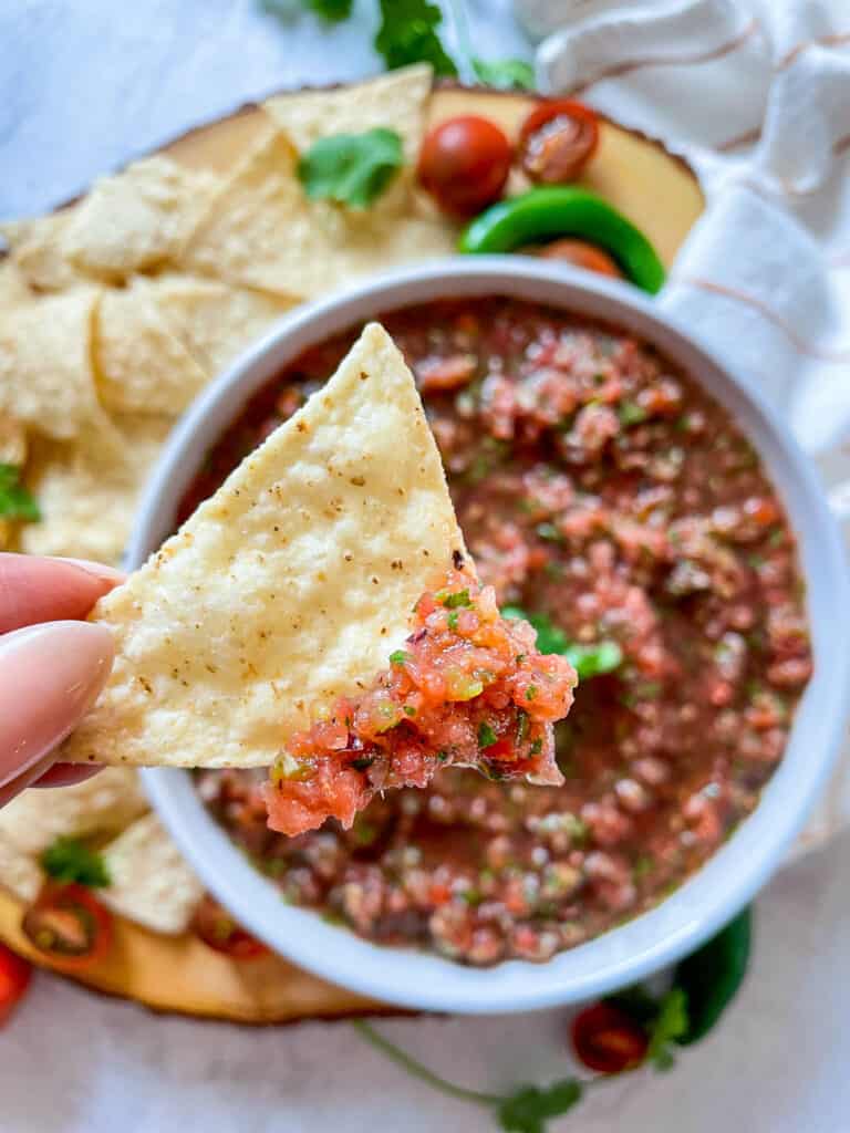 close up of salsa on tortilla chips to show texture