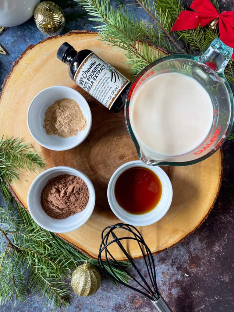 ingredients needed to make maca hot chocolate: non-dairy milk, maple syrup, maca powder, cacao powder, and vanilla extract