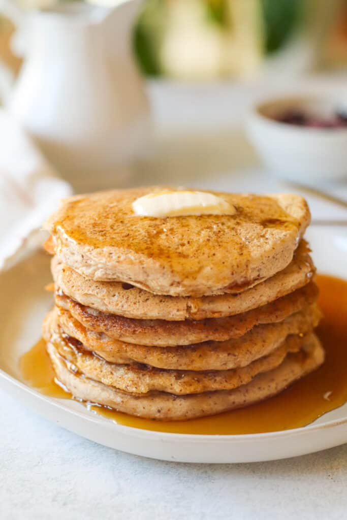 six vegan buttermilk gluten free pancakes with maple syrup