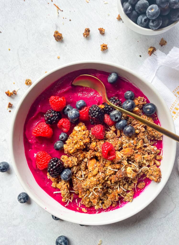 Date Sweetened Grainless Granola on an acai bowl with berries