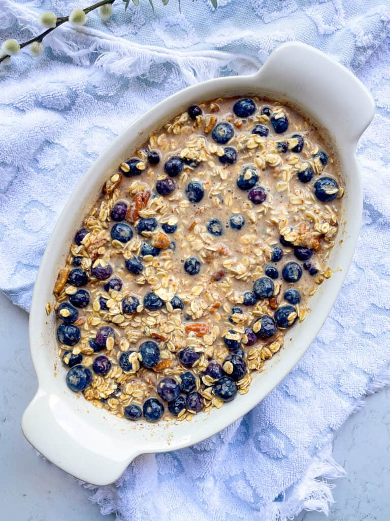 ingredients combined in a baking dish to make baked oatmeal
