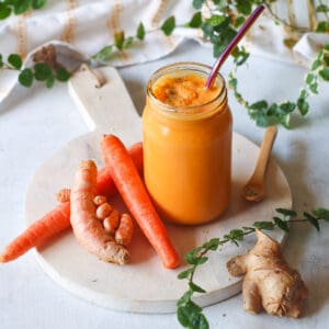 carrot ginger turmeric smoothie with sea moss in a mason jar