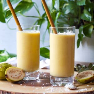 two dairy free guava smoothies with fresh guava pineapple and mango