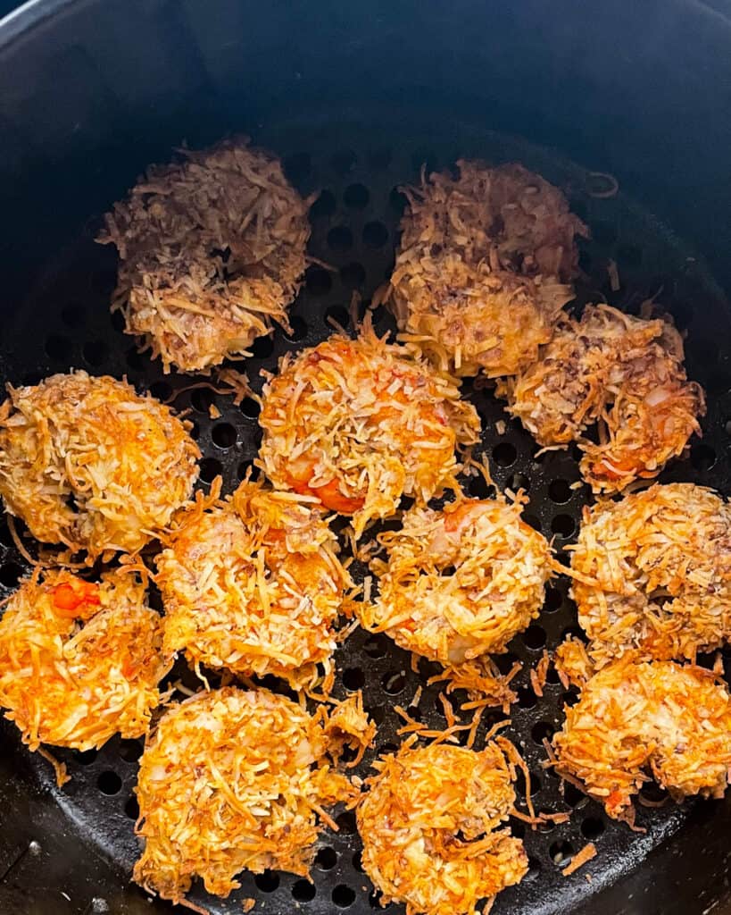 golden brown fully cooked gluten free coconut shrimp in the air fryer