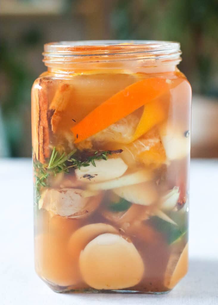 fire cider vinegar with ingredients in jar for fermenting