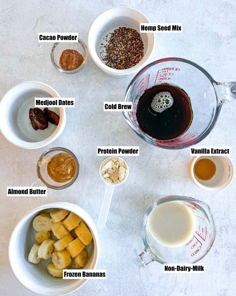 ingredients needed to make coffee smoothie shown in small dishes
