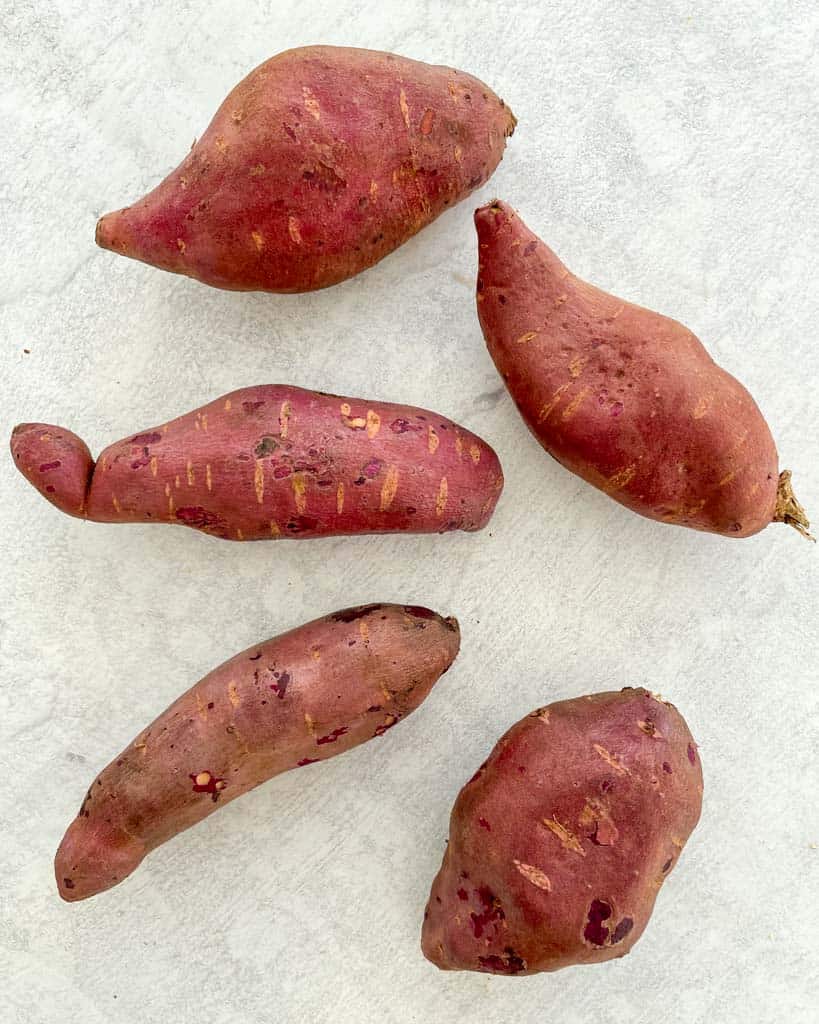 five large long sweet potatoes