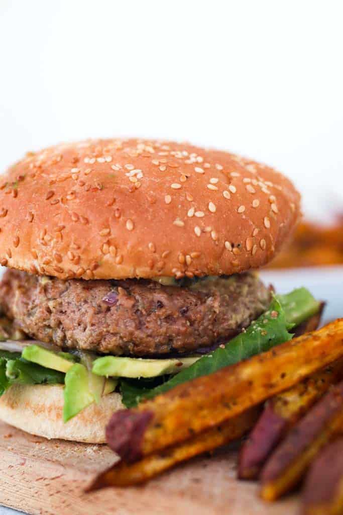 gluten free burger on a gluten free bun served with sweet potato fries