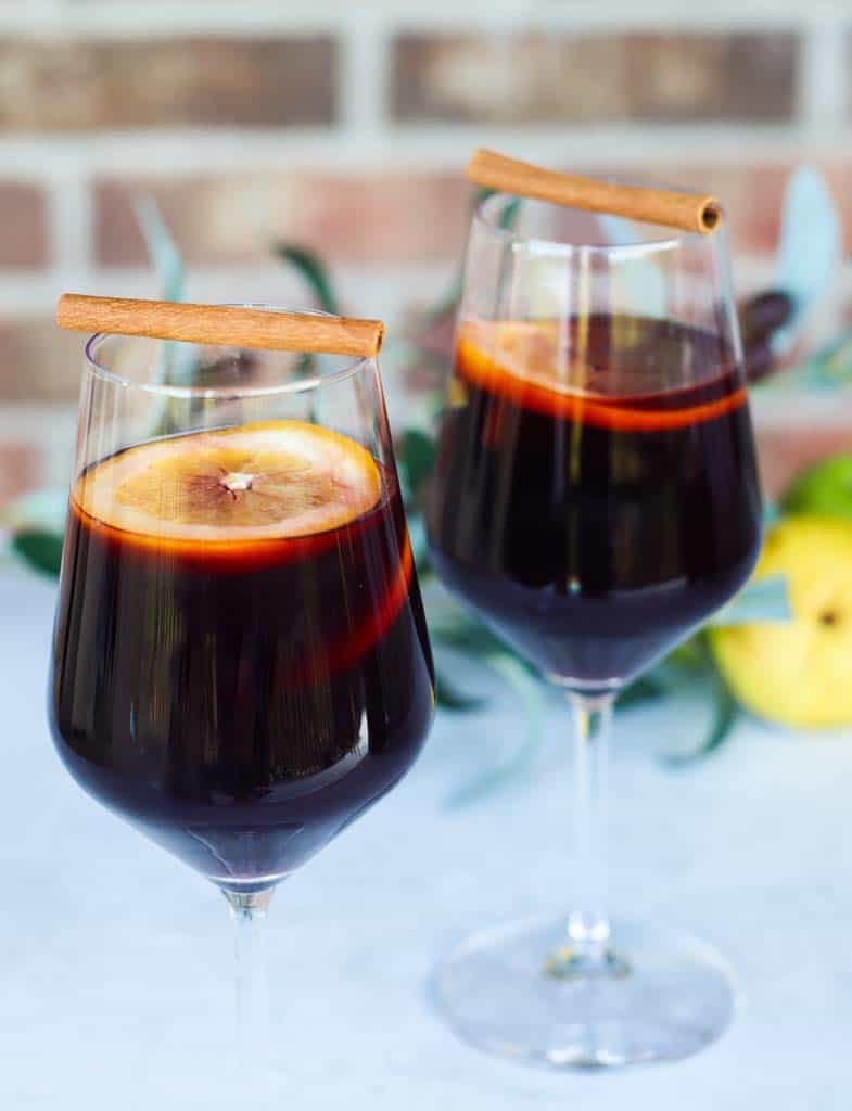 two glasses of fall sangria with apple cider 
