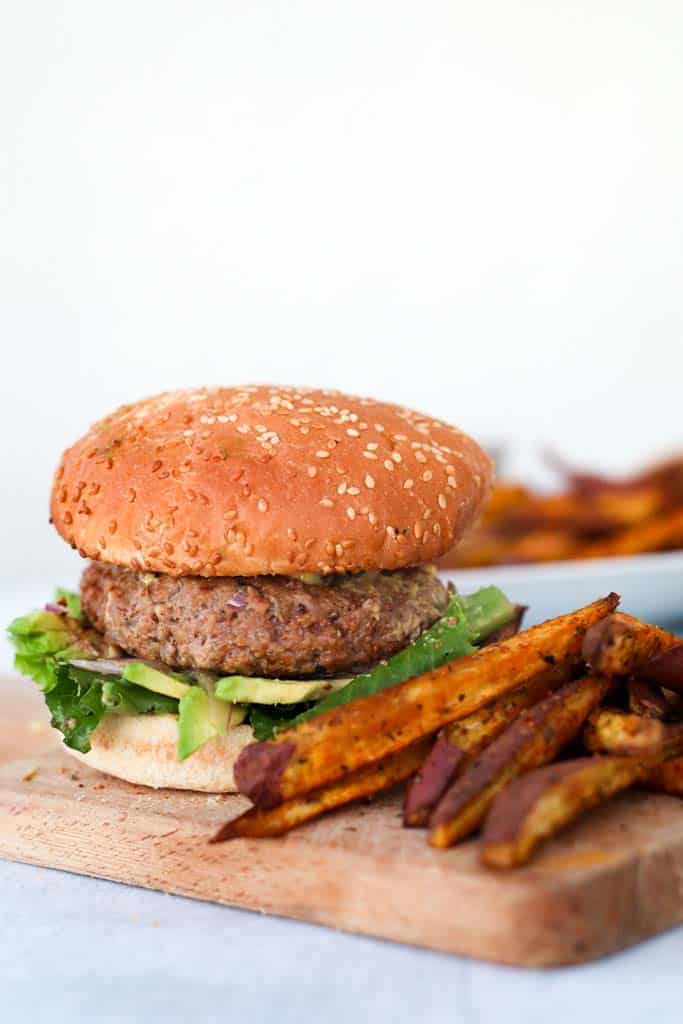 gluten free burger on a gluten free bun served with sweet potato fries