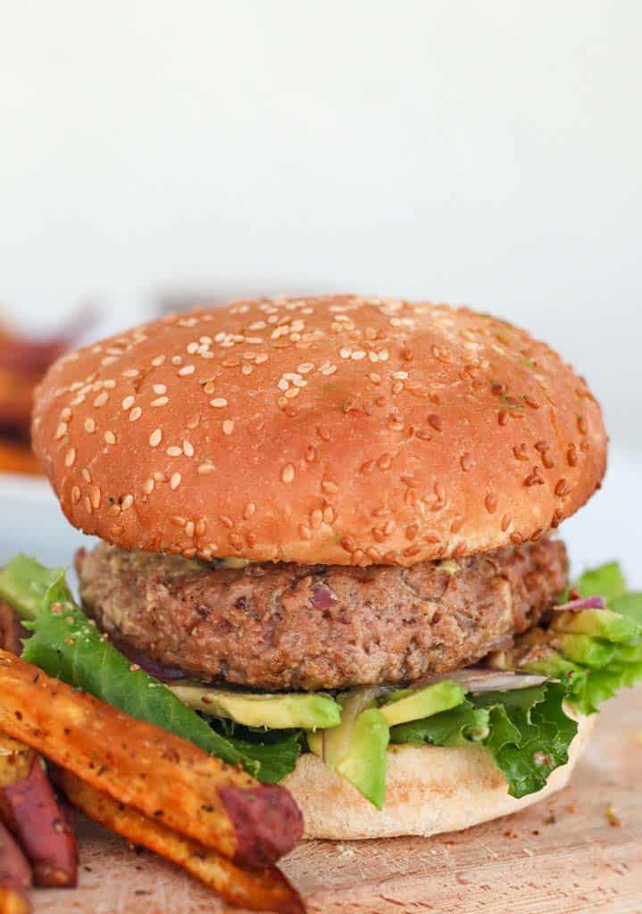 gluten free burger on a gluten free bun served with sweet potato fries