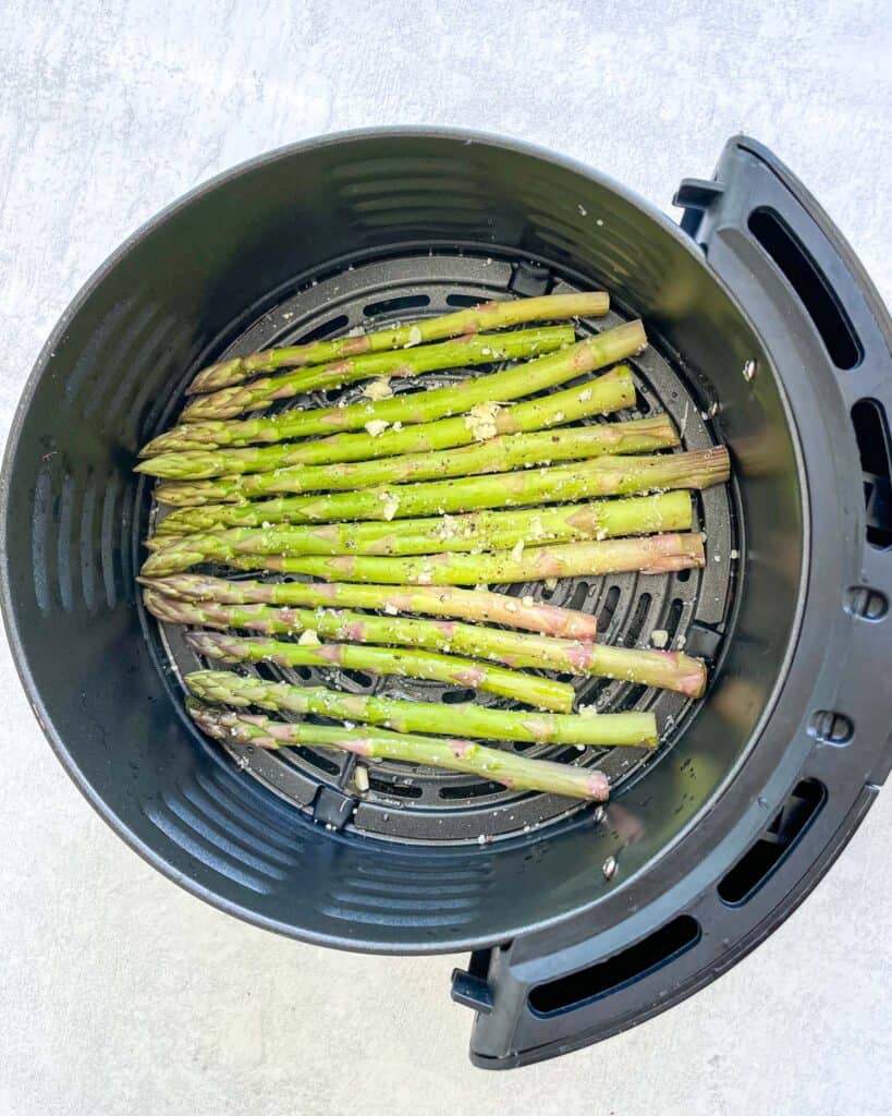 uncooked, cut and seasoned veggies in the air fryer