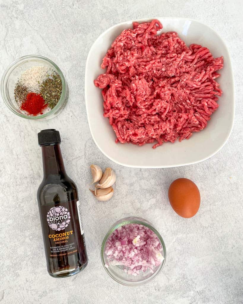 ingredients shown lean ground beef coconut aminos egg 3 garlic cloves minced onion seasonings