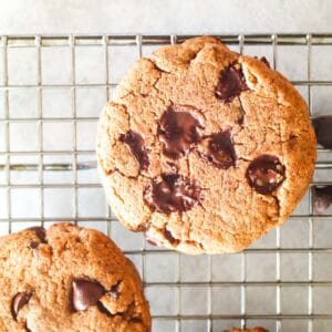 chocolate chip protein cookies on a cooling rack