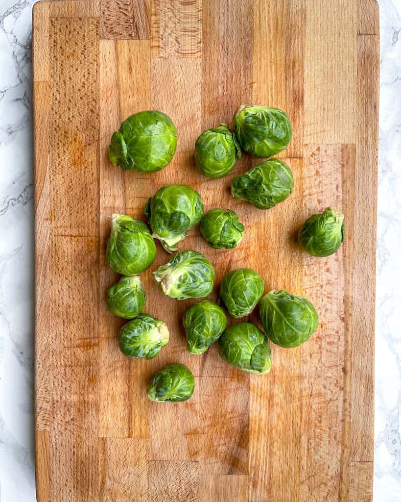 brussels sprouts on a cutting board