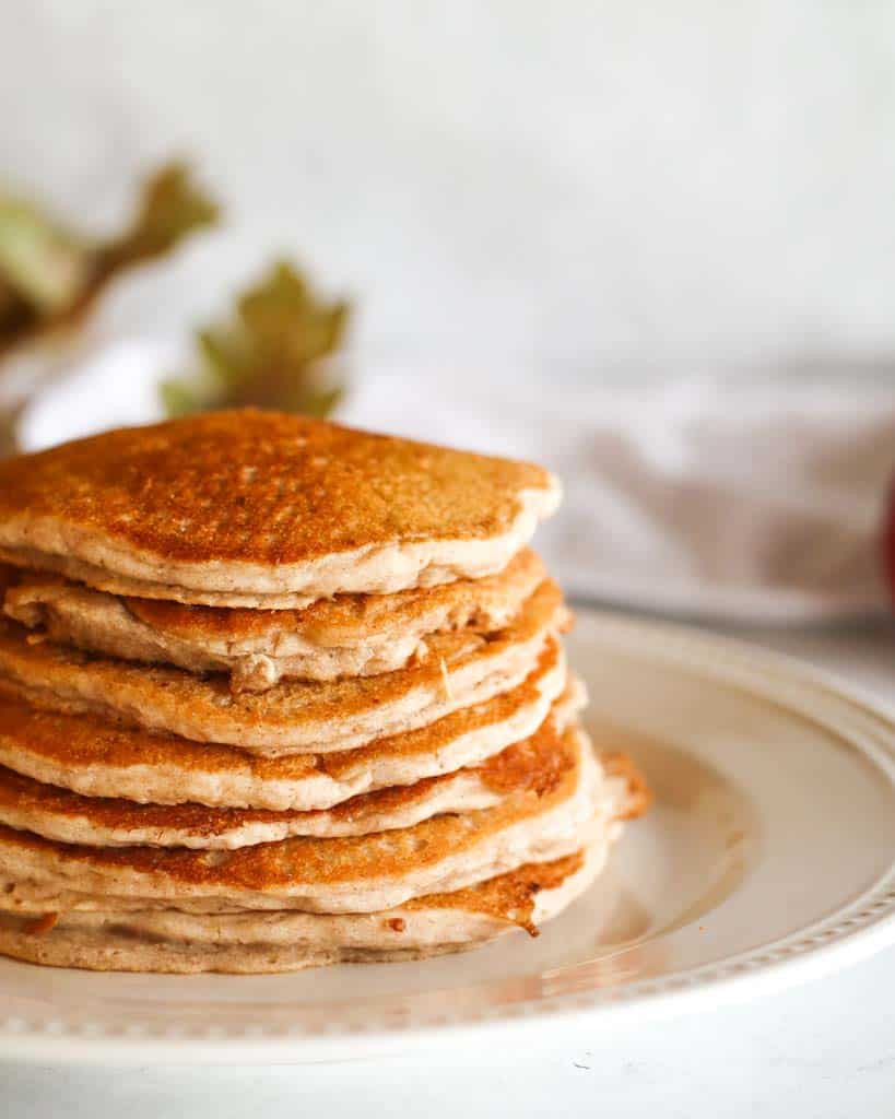 seven apple cinnamon pancakes on a plate