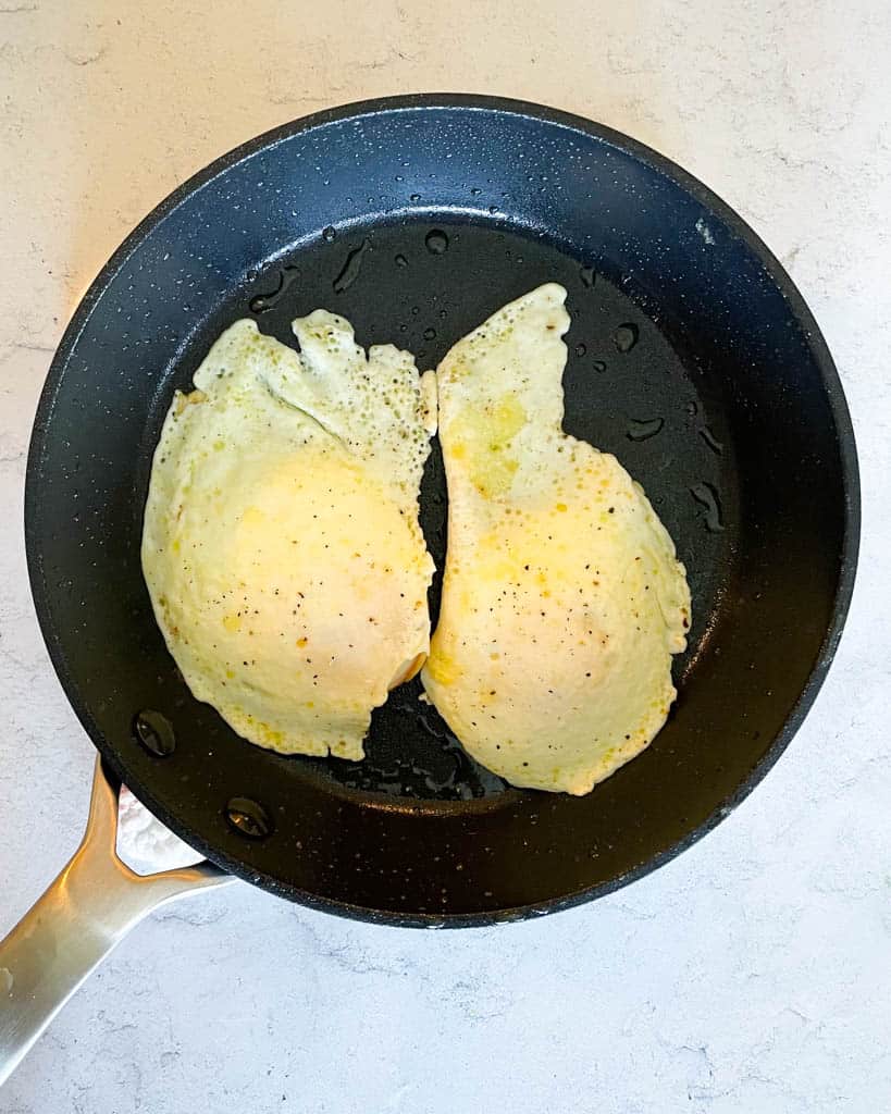 two cooked over medium eggs in a small non stick skillet