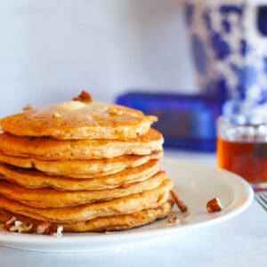 a plated stack of sweet potato pancakes