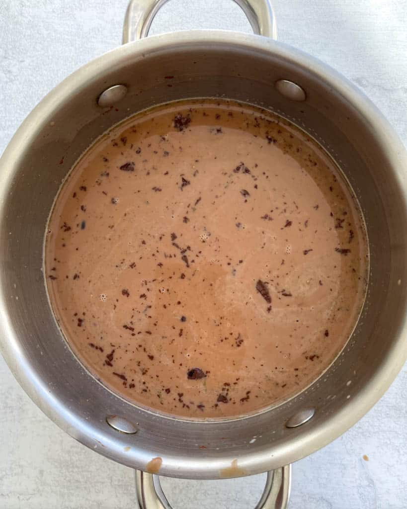 adding dark chocolate to homemade hot chocolate