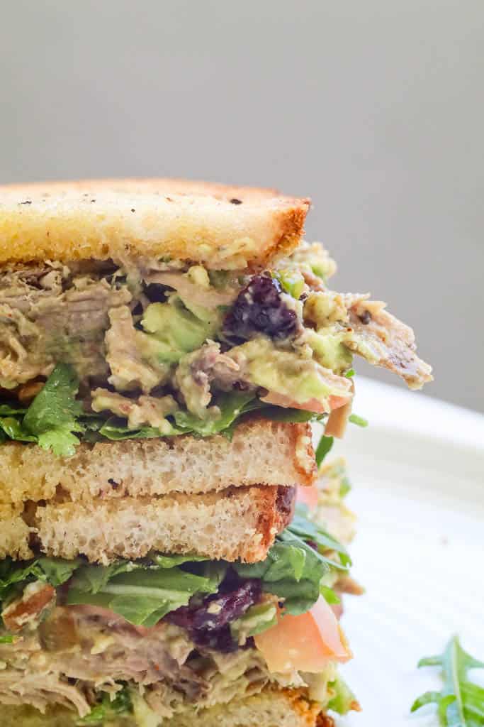 close up view of stacked turkey salad sandwich