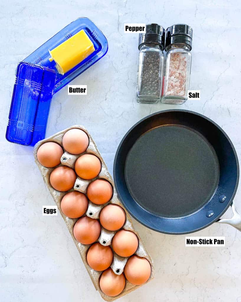 overhead view of butter, salt, pepper, main ingredient, and a non-stick pan