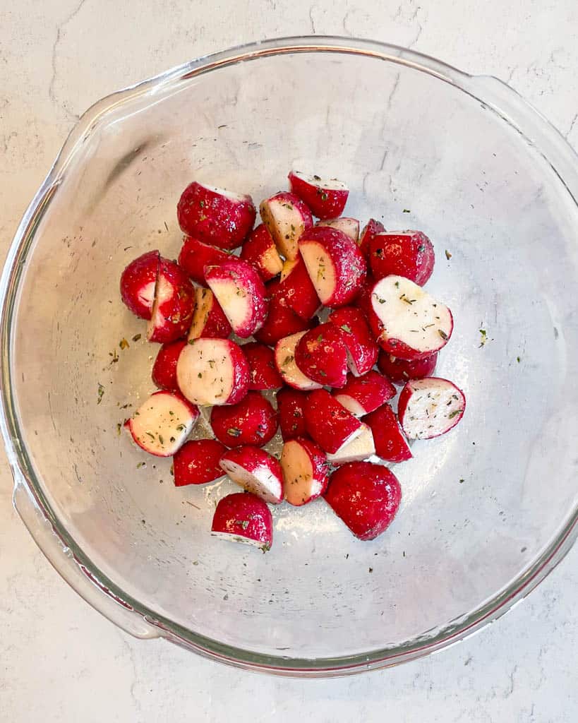 raw diced radishes in a clear bowl