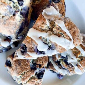 close up view of gluten-free blueberry scones with glaze