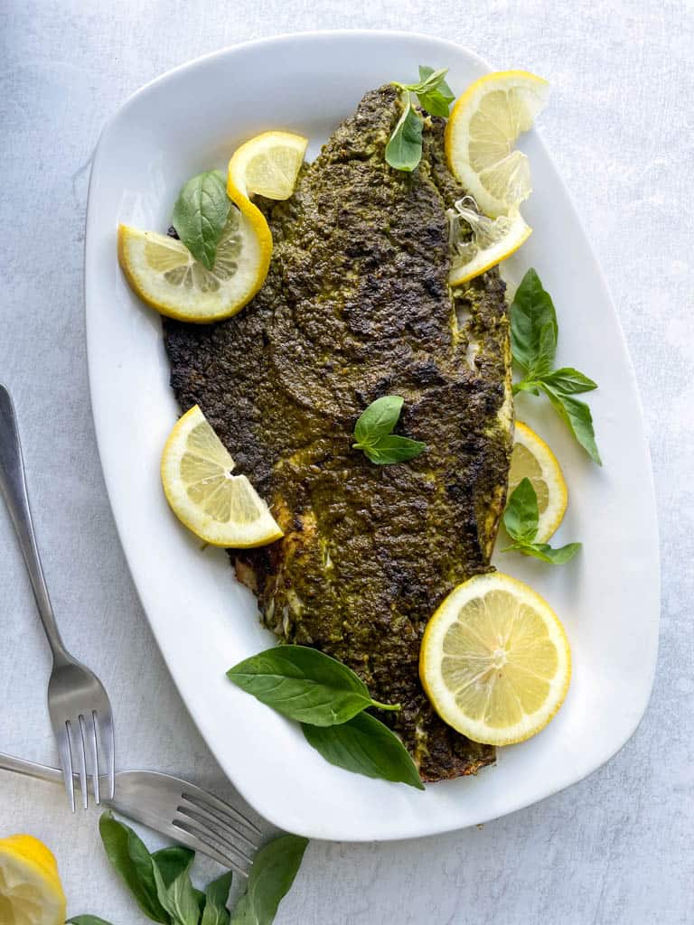 plate of pesto-crusted broiled sea bass