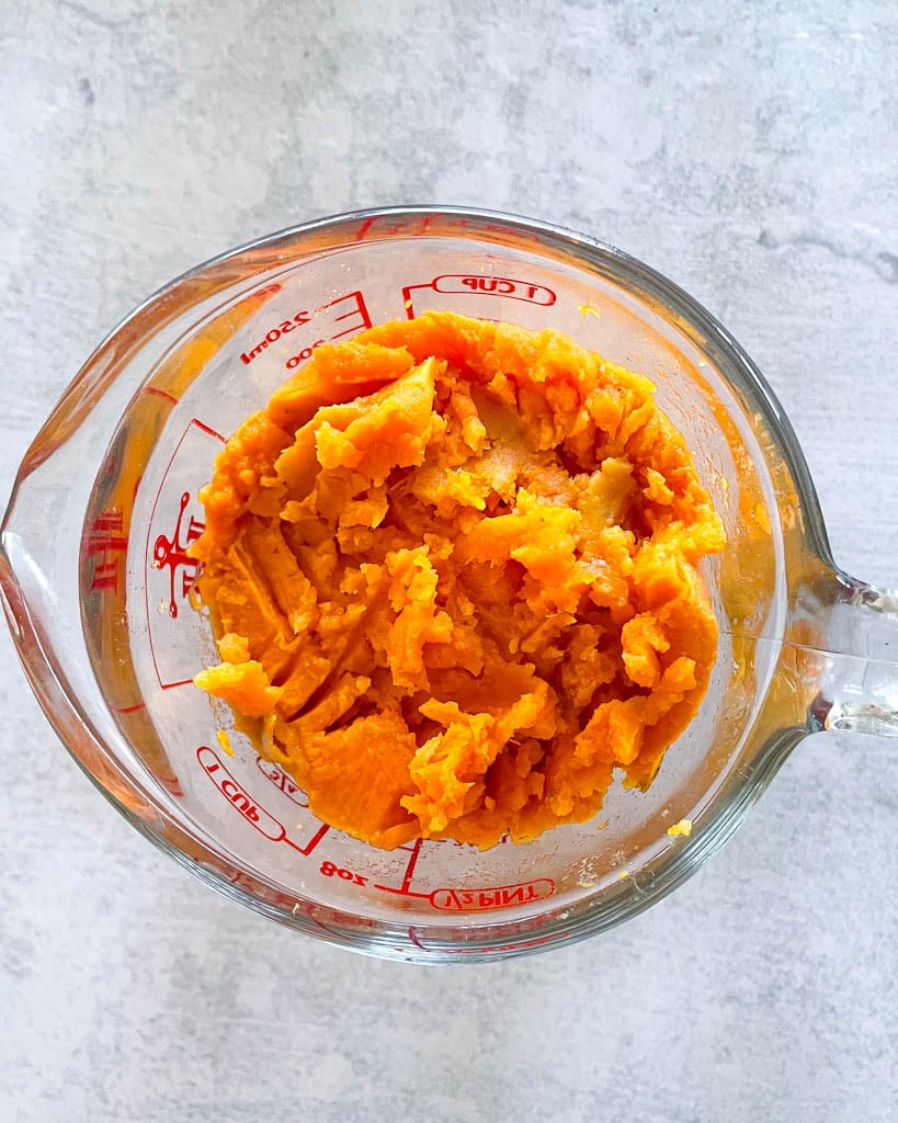 roasted sweet potato puree in a measuring cup