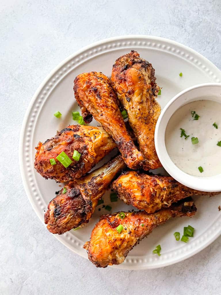 plated air fryer drumsticks with dipping sauce
