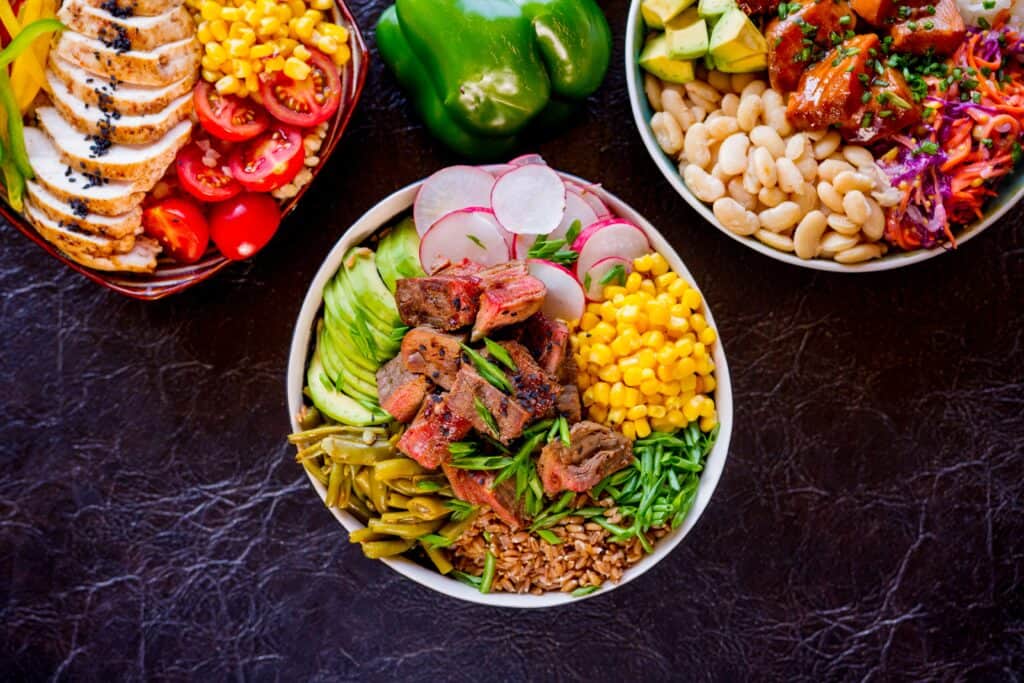overhead view of three gluten-free meals in bowls