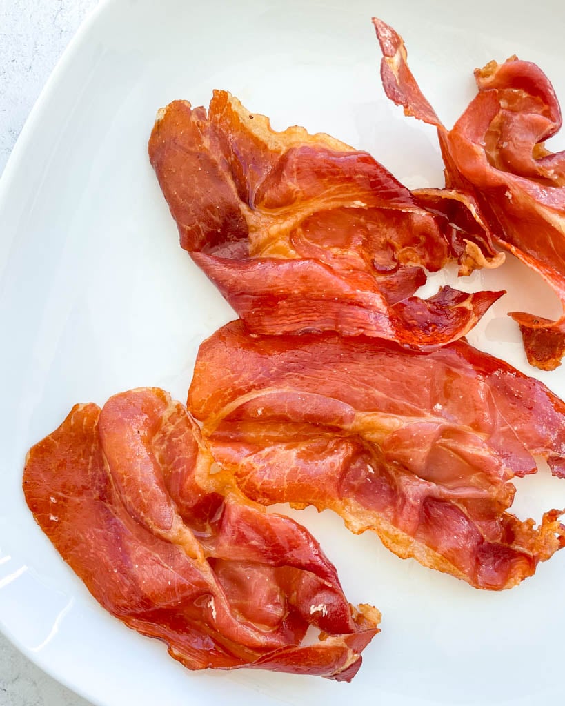 slices of crispy prosciutto on a plate