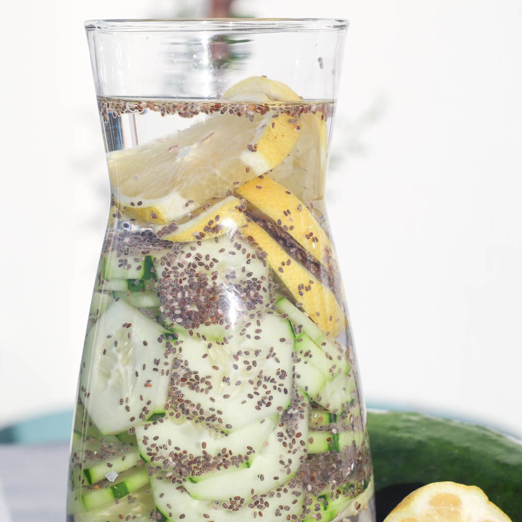 a carafe full of cucumber lemon ginger water