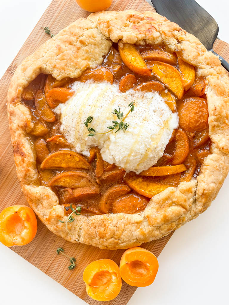 homemade gluten free apricot galette with ice cream on top