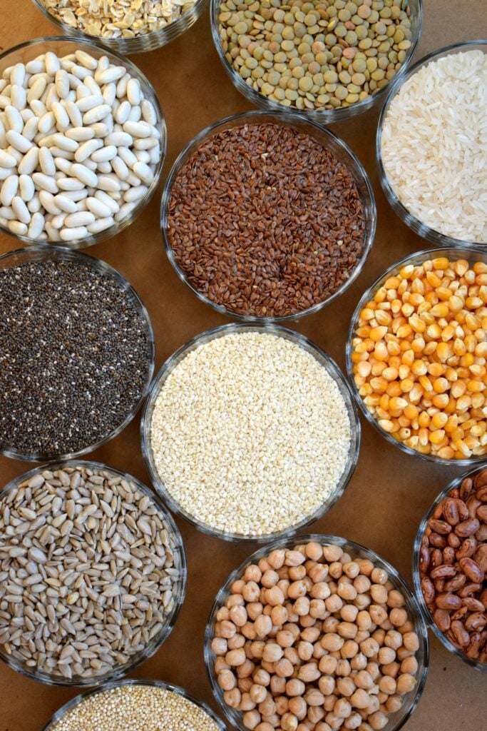 small bowls of grains beans and seeds