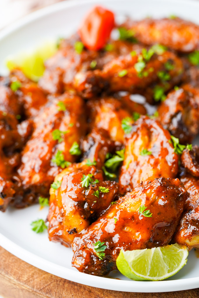 close up view of plated mango habanero wings