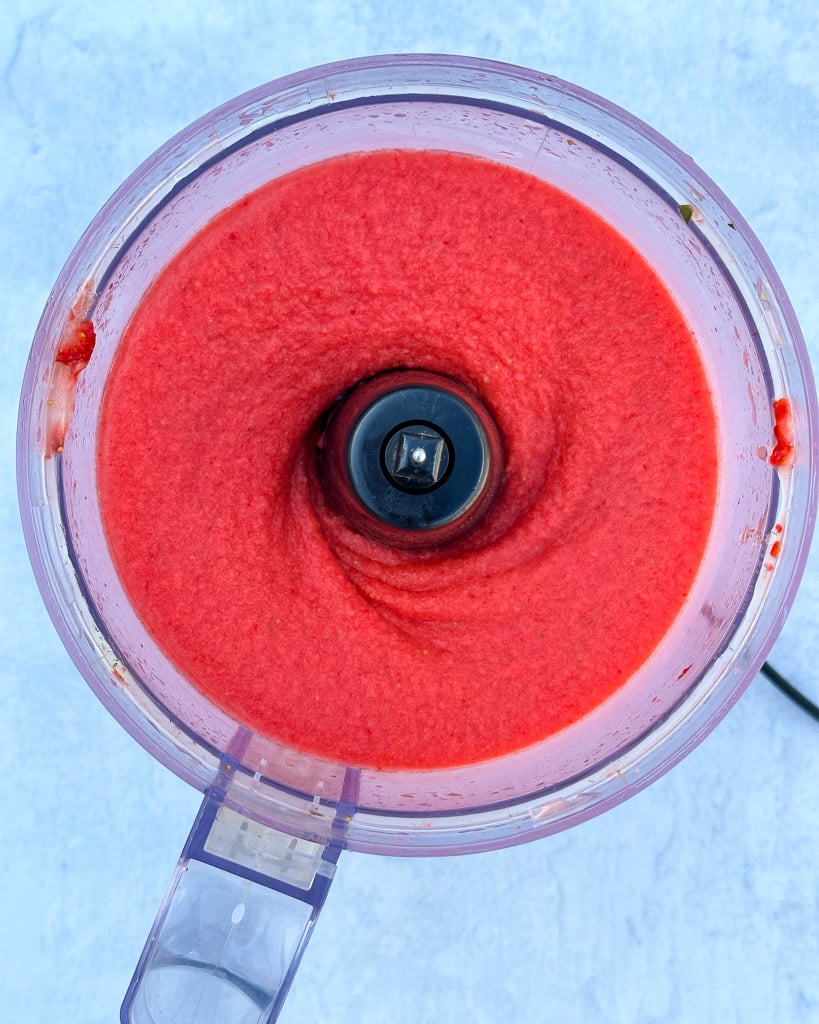 overhead view of strawberry sorbet in a food processor